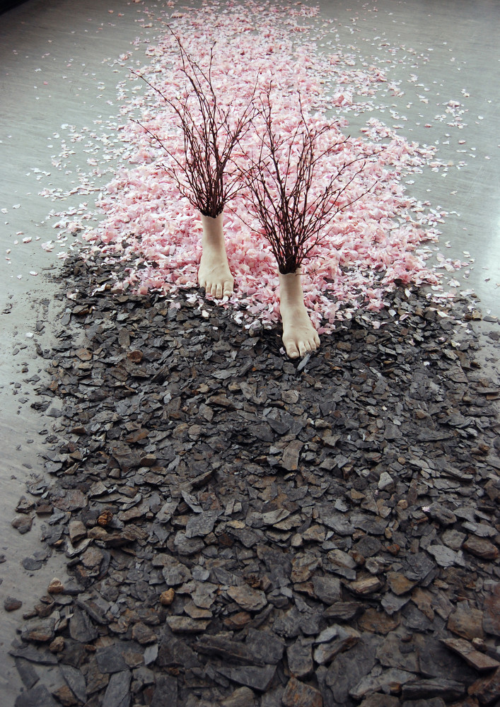 Home to the Rock, installation by Japanese artist Noriko Matsubara. Materials include hanshi, shale, resin cast, and alder twigs. Made in 2007.